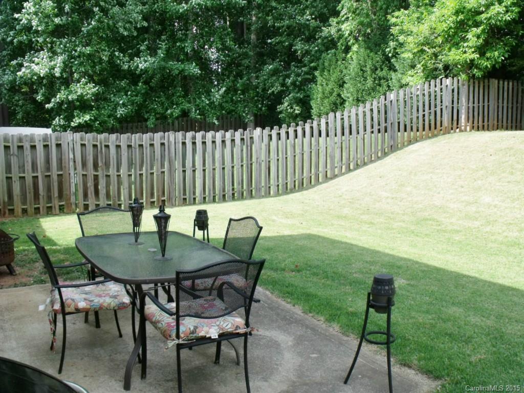 15210 Tracy Beth Road Huntersville, NC 28078 - Photo 20 of 24 a backyard of a house with table and chairs