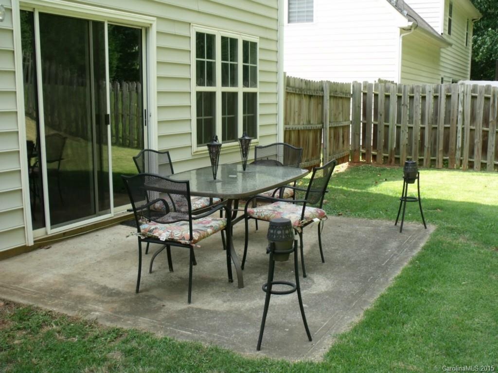 15210 Tracy Beth Road Huntersville, NC 28078 - Photo 23 of 24 a view of a chairs and tables in the backyard