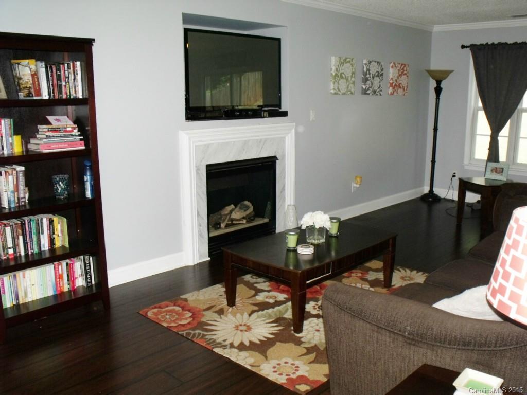 15210 Tracy Beth Road Huntersville, NC 28078 - Photo 5 of 24 a living room with furniture and a fireplace