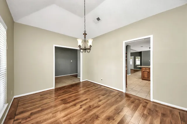 a large kitchen with kitchen island a large counter space a sink stainless steel appliances and cabinets