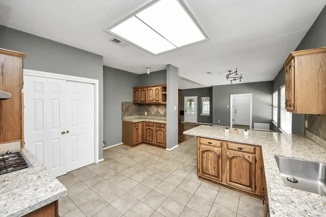 a large kitchen with cabinets