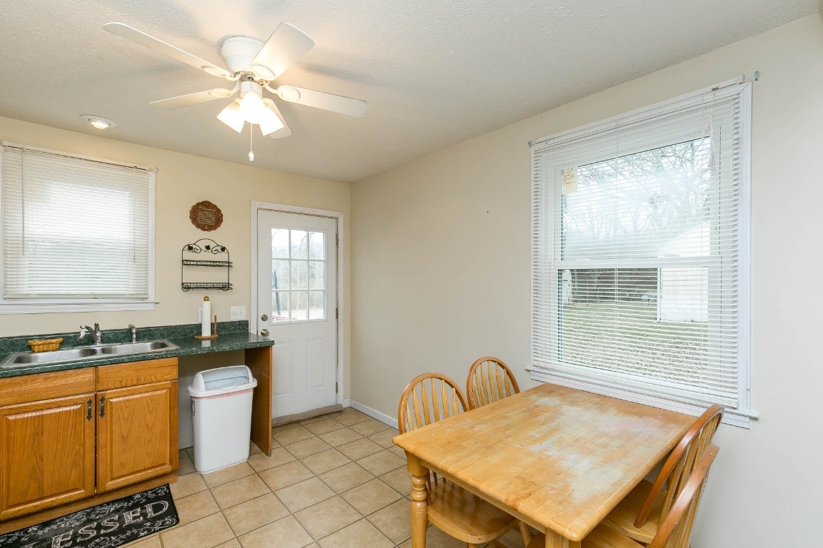 304 Randy Road Madison, TN 37115 - Photo 12 of 34 a bathroom with a sink a toilet a mirror and vanity