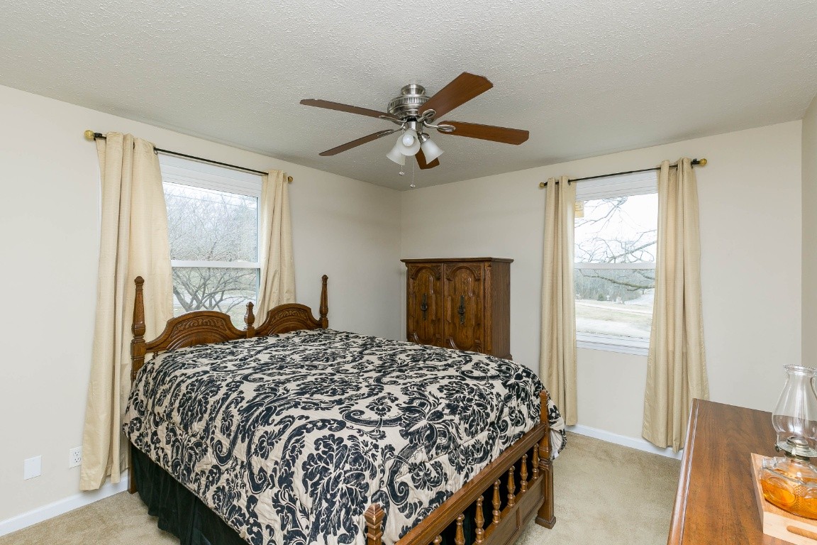 304 Randy Road Madison, TN 37115 - Photo 17 of 34 a bedroom with a large bed and a window