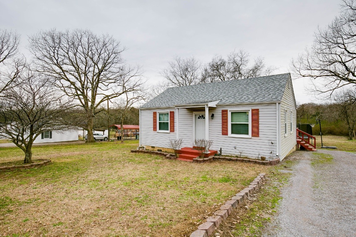 304 Randy Road Madison, TN 37115 - Photo 2 of 34 a view of a backyard with a large tree