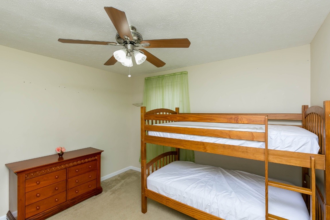 304 Randy Road Madison, TN 37115 - Photo 22 of 34 a bedroom with a bed and a ceiling fan