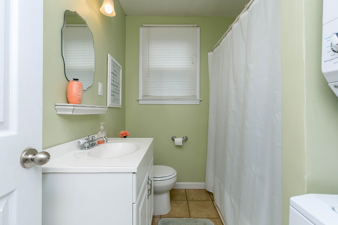 304 Randy Road Madison, TN 37115 - Photo 25 of 34 a bathroom with a sink a toilet and a mirror