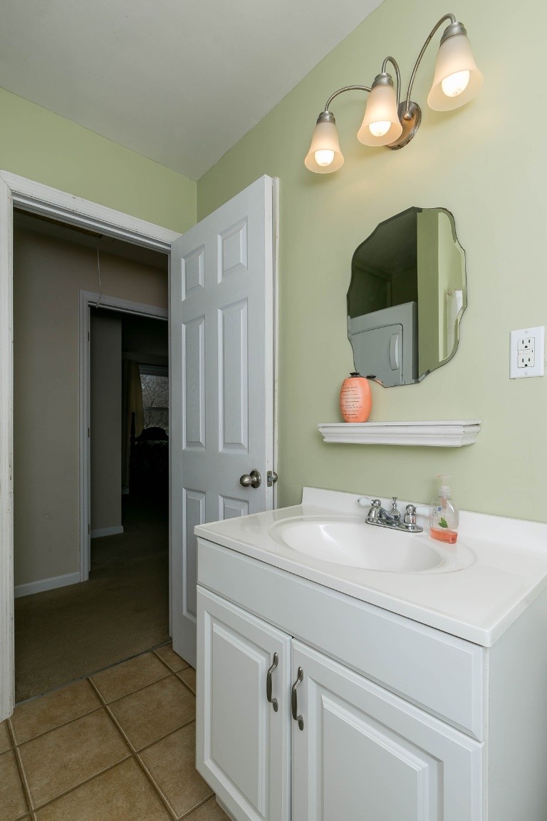 304 Randy Road Madison, TN 37115 - Photo 26 of 34 a bathroom with a sink and a mirror