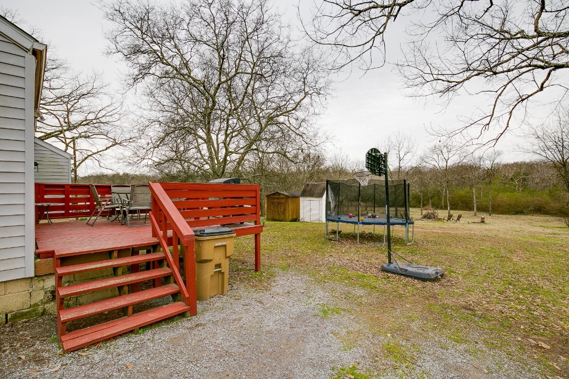 304 Randy Road Madison, TN 37115 - Photo 28 of 34 a backyard of a house with barbeque oven table and sofas