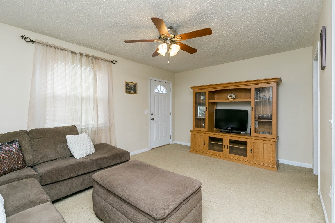 304 Randy Road Madison, TN 37115 - Photo 6 of 34 a living room with furniture and a flat screen tv