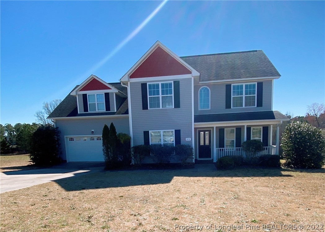 30 Hanson Court Bunnlevel, NC 28323 - Photo 1 of 4 a front view of a house with a yard