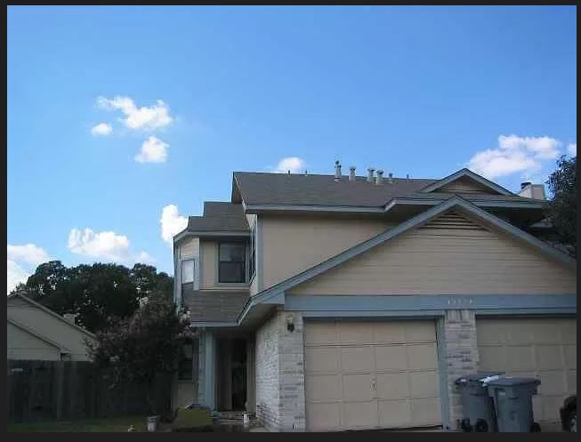 12308 A Los Indios Trail Austin, TX 78729 - Photo 1 of 19 a front view of a house with a yard