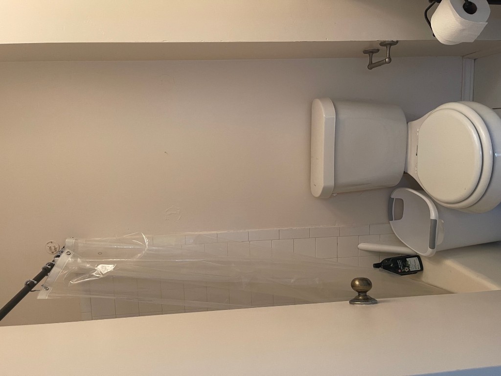 12308 A Los Indios Trail Austin, TX 78729 - Photo 15 of 19 a white toilet sitting next to a shower