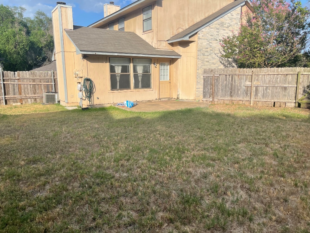 12308 A Los Indios Trail Austin, TX 78729 - Photo 3 of 19 a view of a house with backyard and a tree