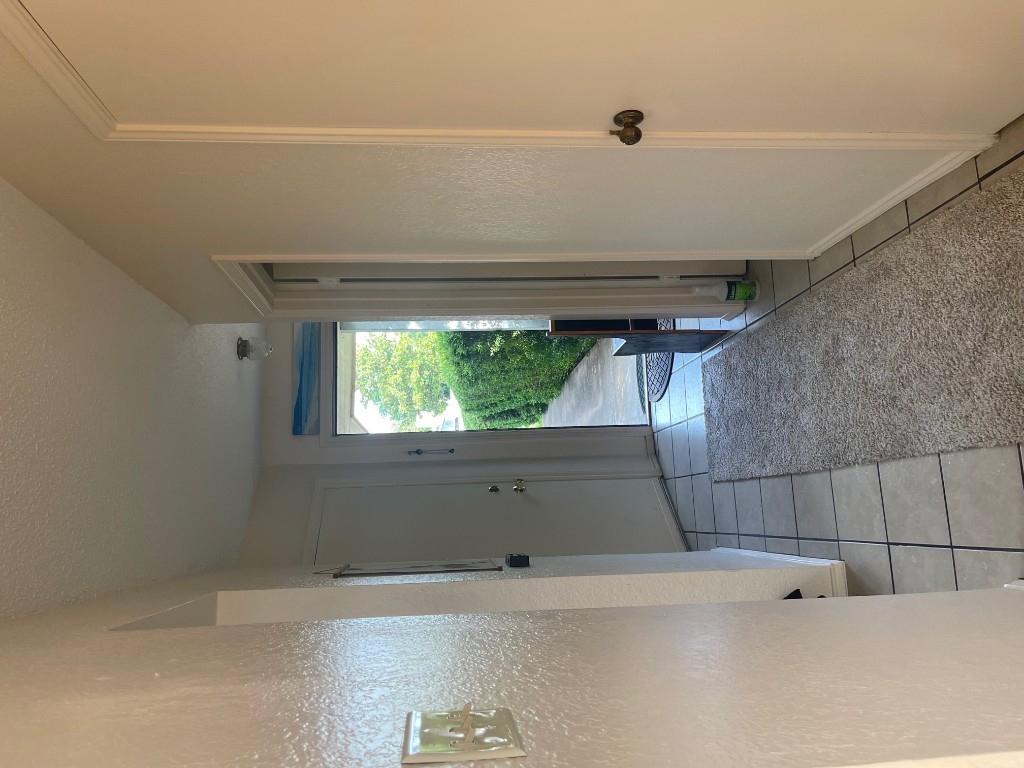 12308 A Los Indios Trail Austin, TX 78729 - Photo 9 of 19 a view of entryway with window