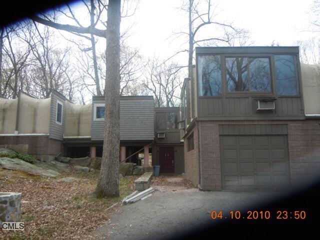 20 Deepwood Road Weston, CT 06883 - Photo 1 of 1 a view of a house with a yard and garage