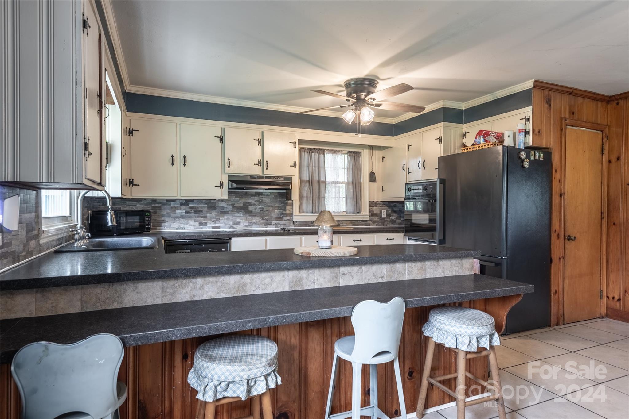 3913 Belk Mill Road Monroe, NC 28112 - Photo 6 of 25 a kitchen with stainless steel appliances granite countertop a sink refrigerator and cabinets