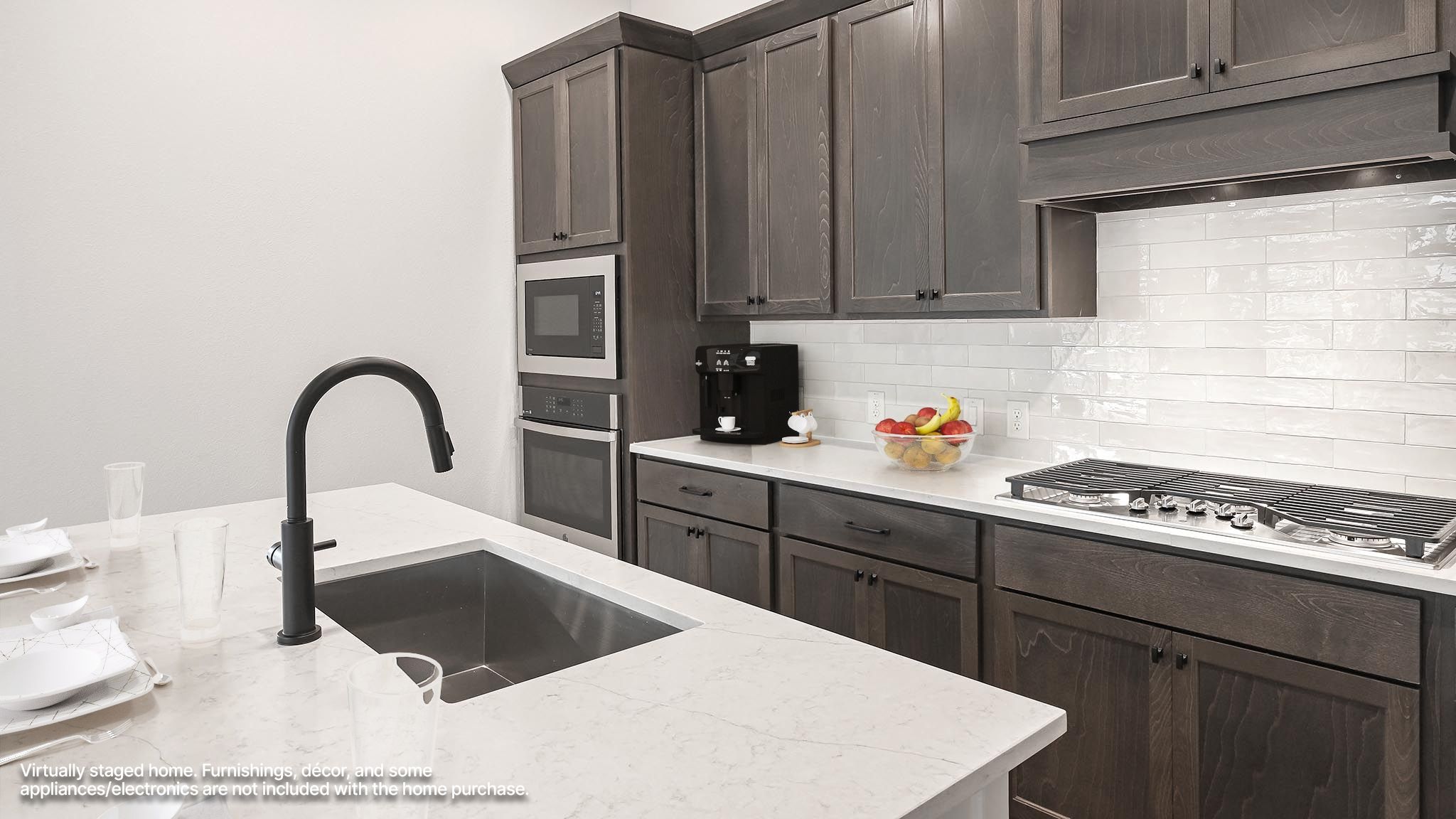 126 Basket Flower Loop Kyle, TX 78640 - Photo 4 of 29 a kitchen with a stove a sink and a refrigerator