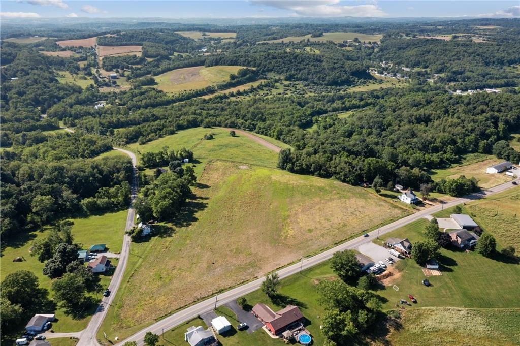 0 Mt Pleasant Road Greensburg, PA 15601 - Photo 2 of 16 an aerial view of a house a yard and mountain view