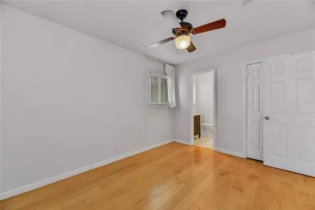 a view of a room with a ceiling fan