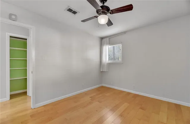 an empty room with a empty space and windows