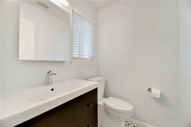 a bathroom with a sink a toilet and a bathtub