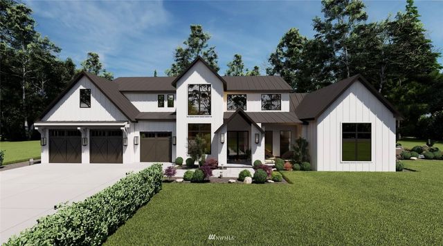 a view of a white house with a yard