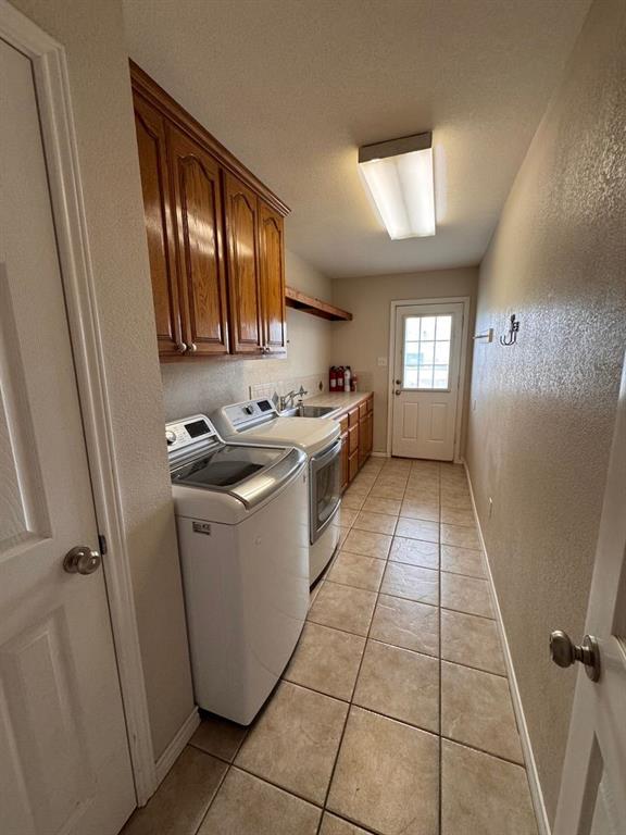 158 Codybug Road Abilene, TX 79602 - Photo 13 of 21 a kitchen with a sink a stove top oven and cabinets