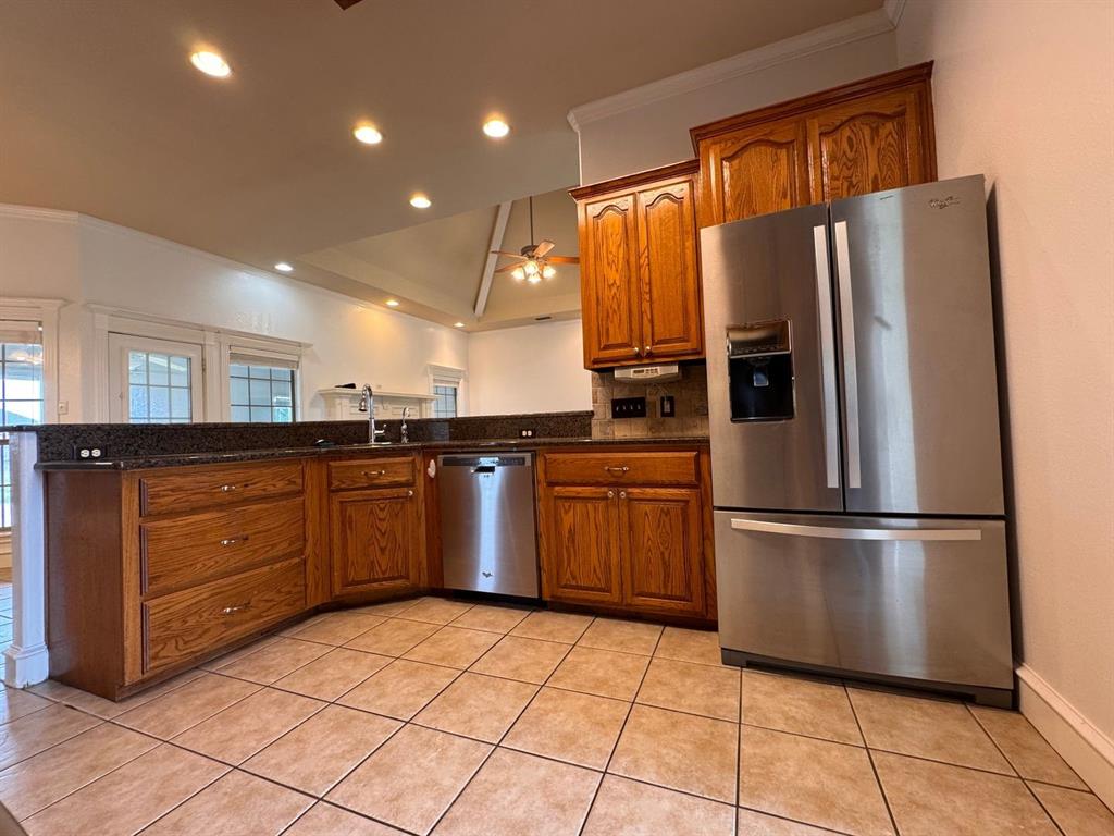 158 Codybug Road Abilene, TX 79602 - Photo 15 of 21 a kitchen with stainless steel appliances granite countertop a refrigerator and a sink