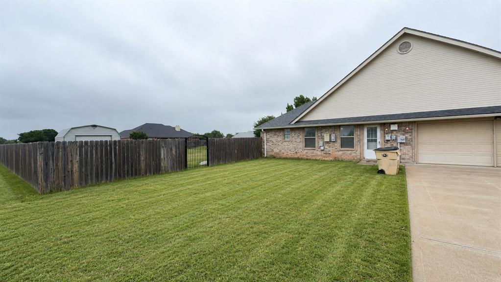 158 Codybug Road Abilene, TX 79602 - Photo 18 of 21 a view of a house with backyard and a tree