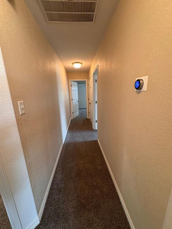 158 Codybug Road Abilene, TX 79602 - Photo 9 of 21 a view of a hallway with wooden floor