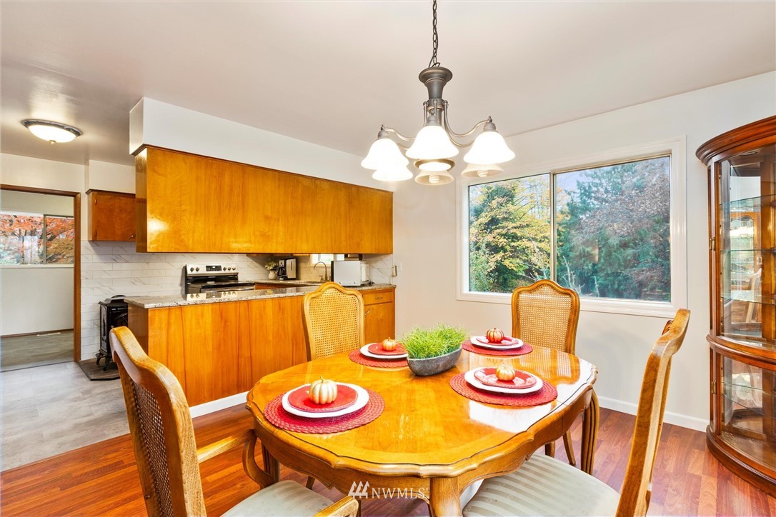 2802 Cavalero Road Lake Stevens, WA 98258 - Photo 8 of 29 a view of a dining room with furniture window and wooden floor