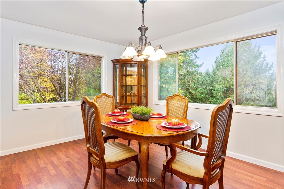 2802 Cavalero Road Lake Stevens, WA 98258 - Photo 9 of 29 a view of a dining room with furniture and a chandelier