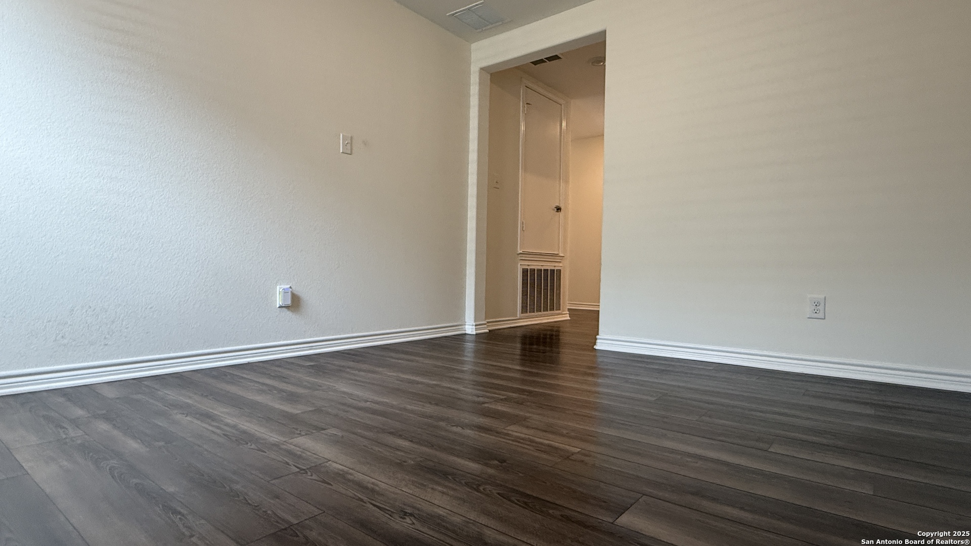 3560 Under Par San Antonio, TX 78245 - Photo 19 of 27 a view of an empty room with wooden floor