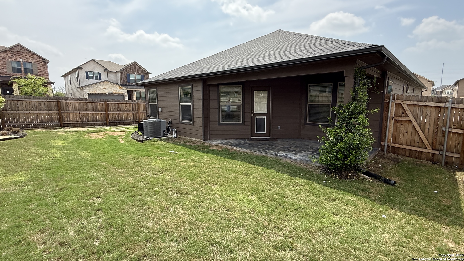 3560 Under Par San Antonio, TX 78245 - Photo 25 of 27 a view of a house with table and chairs in patio