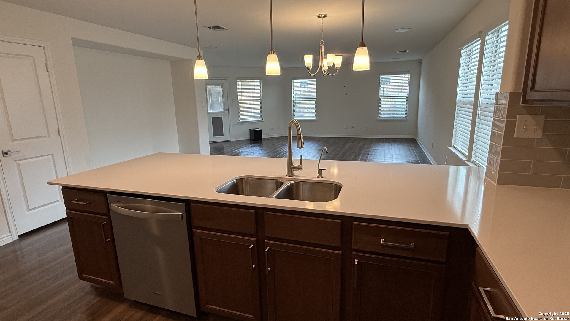 3560 Under Par San Antonio, TX 78245 - Photo 6 of 27 a kitchen with a sink a counter space and wooden floor