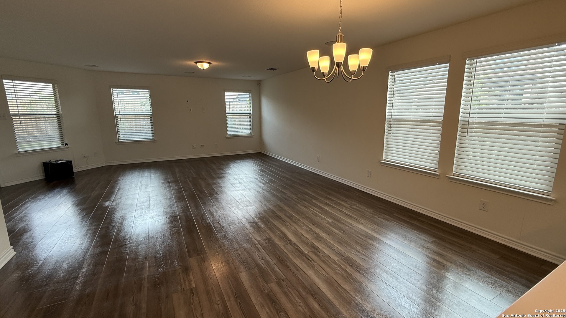 3560 Under Par San Antonio, TX 78245 - Photo 7 of 27 a view of a livingroom with hardwood floor and a large window