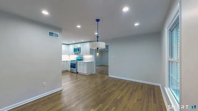 a view of a kitchen with a sink and dishwasher