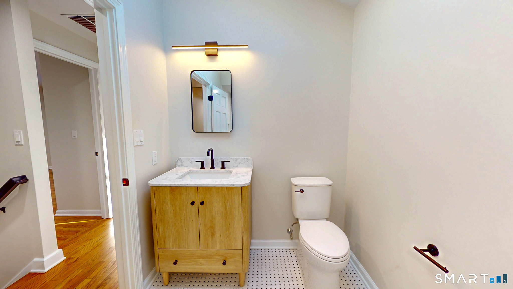 12 Werf Drive Redding, CT 06896 - Photo 20 of 40 a bathroom with a toilet sink and mirror