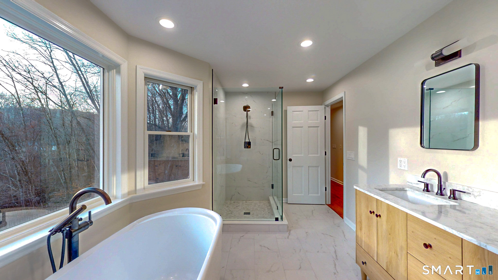 12 Werf Drive Redding, CT 06896 - Photo 23 of 40 a bathroom with a tub sink double vanity and a mirror