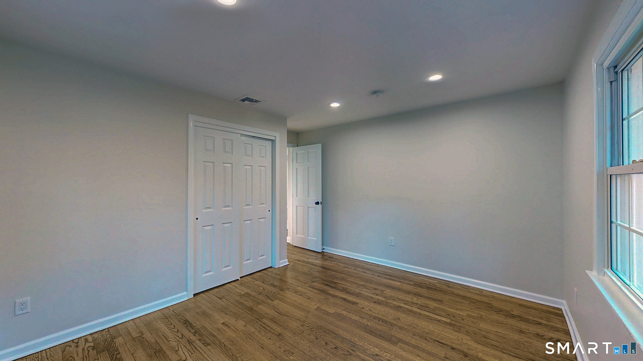 12 Werf Drive Redding, CT 06896 - Photo 34 of 40 a view of an empty room with wooden floor