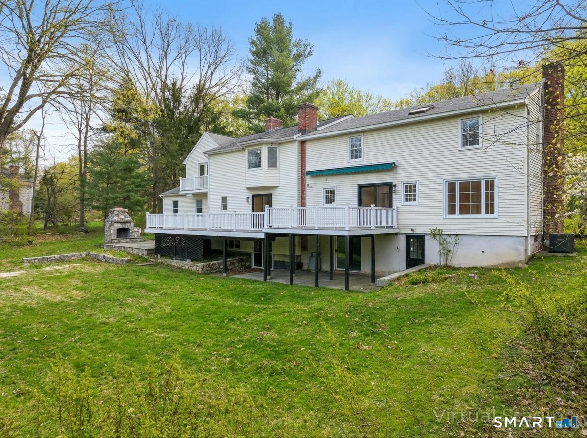 12 Werf Drive Redding, CT 06896 - Photo 5 of 40 a view of a house with a big yard and large trees