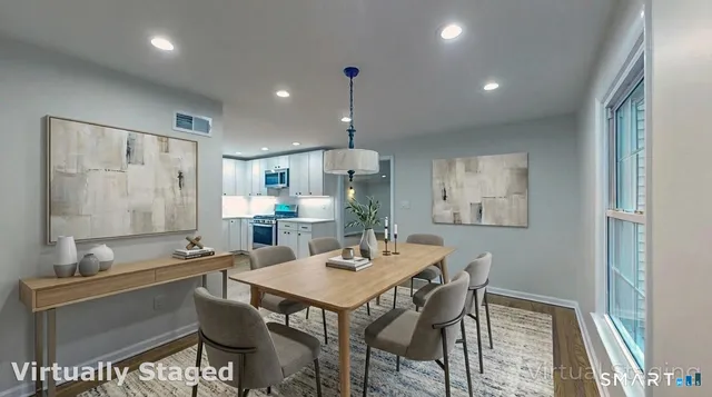 a dining room with a table and chairs