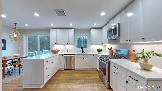 a kitchen with stainless steel appliances granite countertop counter space cabinets and a sink