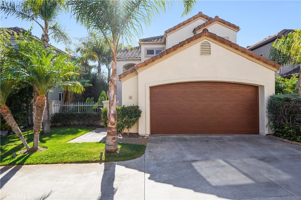 6 Marquesa Dana Point, CA 92629 - Photo 11 of 46 a view of a white house with a small yard and palm trees