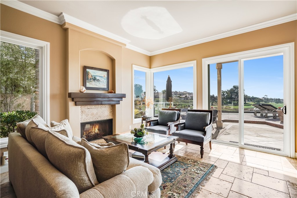 6 Marquesa Dana Point, CA 92629 - Photo 18 of 46 a living room with furniture and a fireplace