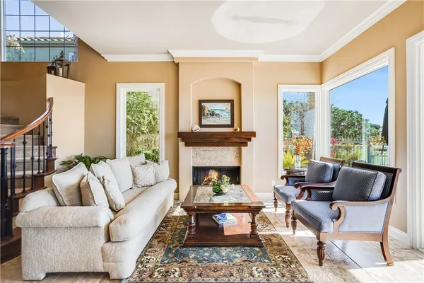 a living room with furniture and a fireplace