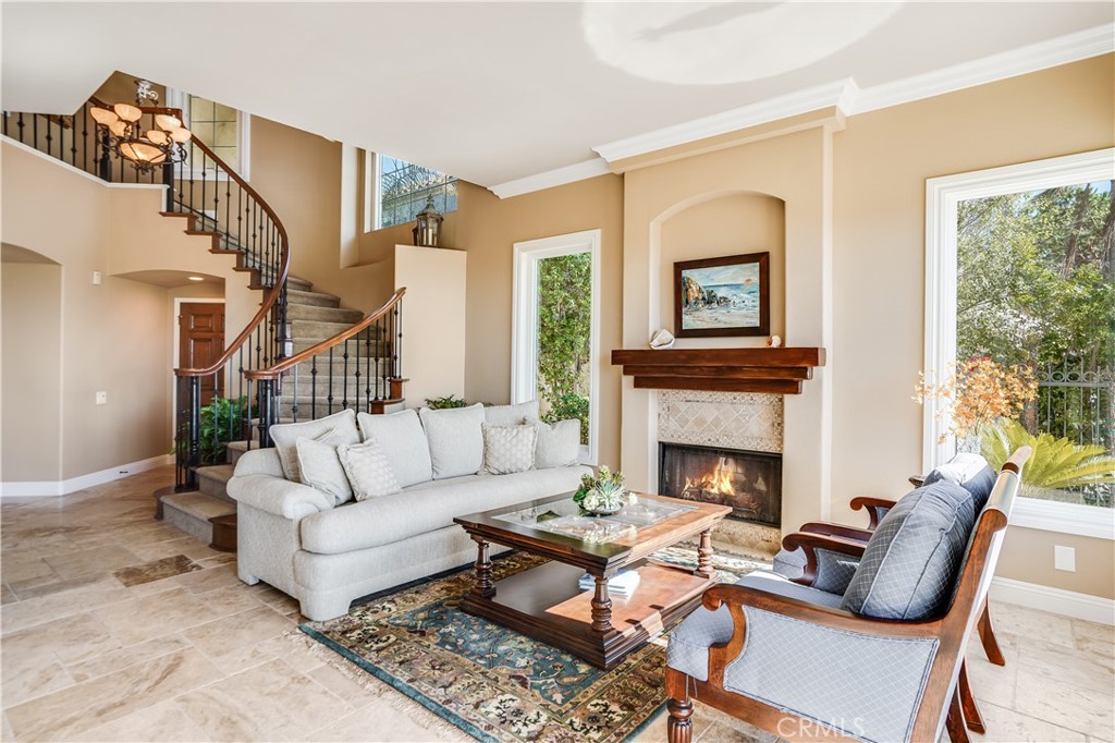 6 Marquesa Dana Point, CA 92629 - Photo 20 of 46 a living room with furniture fireplace and a window