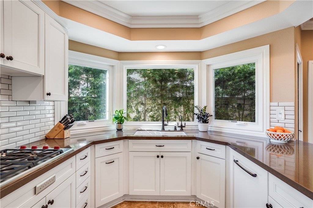 6 Marquesa Dana Point, CA 92629 - Photo 25 of 46 a kitchen with sink a large window and cabinets