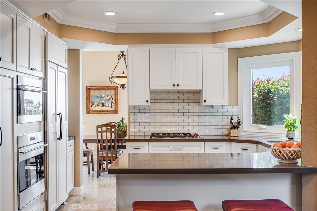 6 Marquesa Dana Point, CA 92629 - Photo 28 of 46 a kitchen with granite countertop a sink and a stove