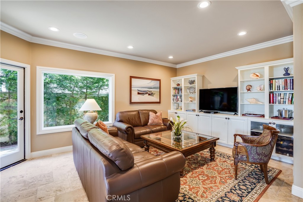 6 Marquesa Dana Point, CA 92629 - Photo 31 of 46 a living room with furniture and a flat screen tv